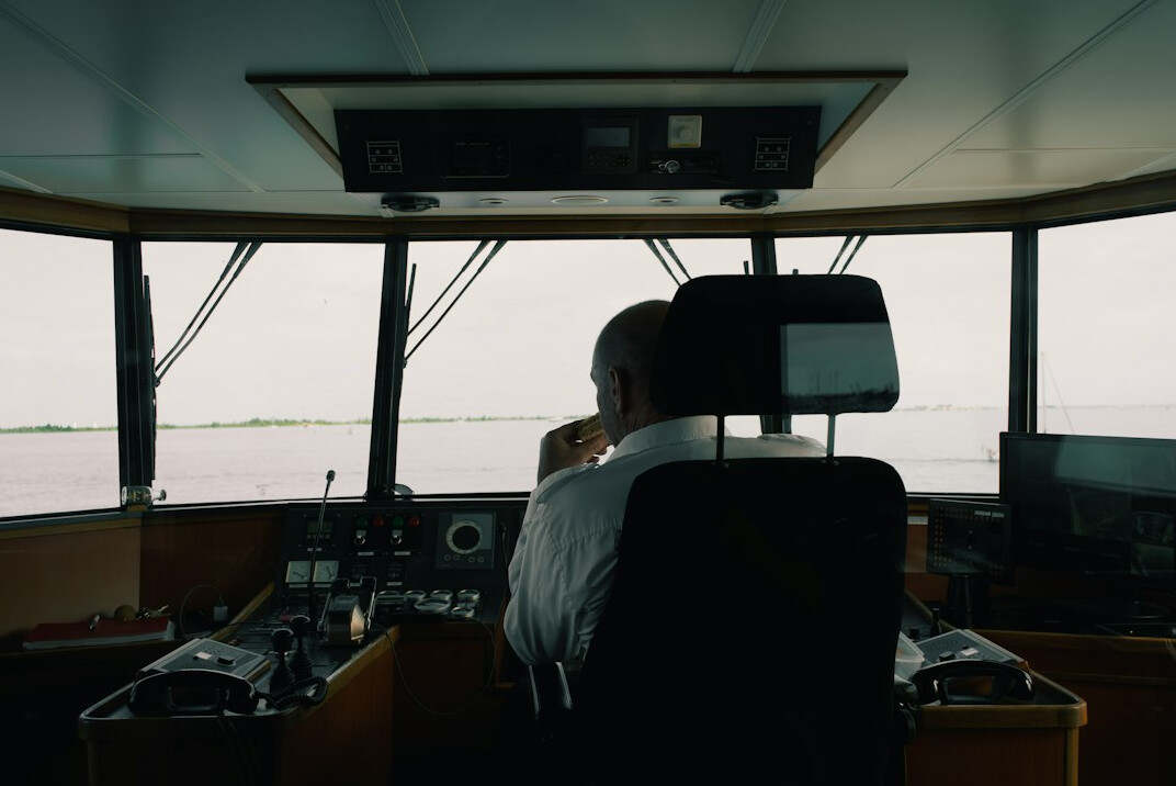 Director monitoring multiple screens in a broadcast control room