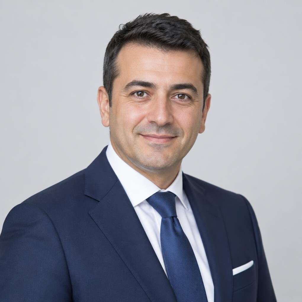 Turkish man in his 40s in business attire, professional portrait