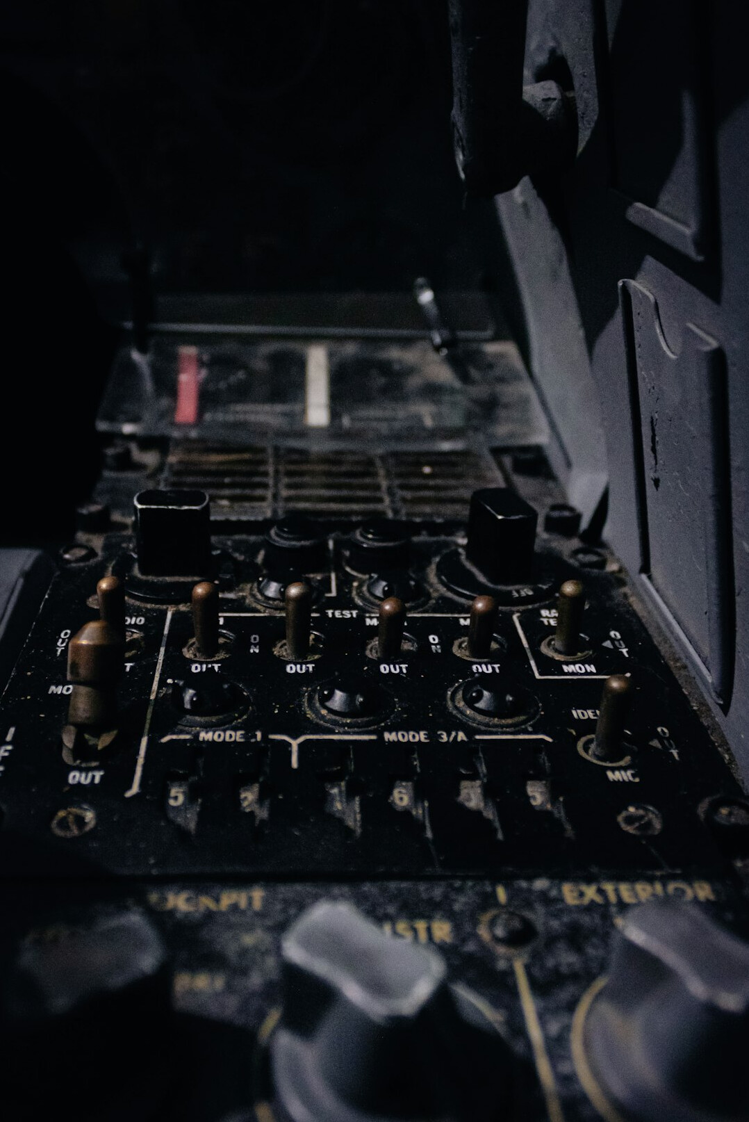 Close-up of a television studio microphone and mixing console